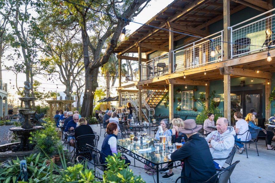 People dining outside downtown in Fernandina Beach, FL