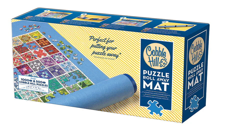 Cobble Hill puzzle roll away mat, elegantly packaged with vibrant puzzle images and a rolled blue mat on the front.