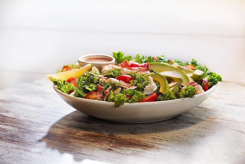 large salad on wooden table