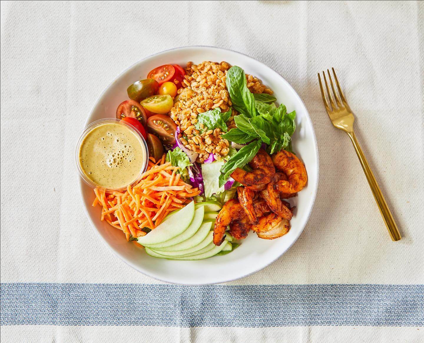 shrimp salad with vegetables in bowl