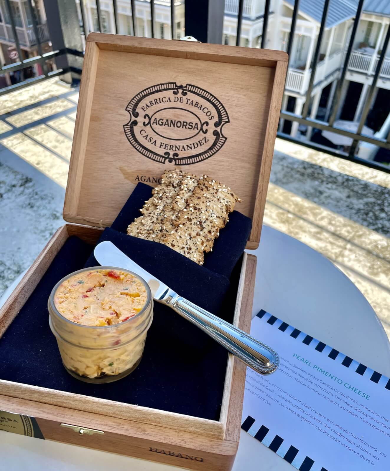 Local made pimento cheese and bread in wooden box.