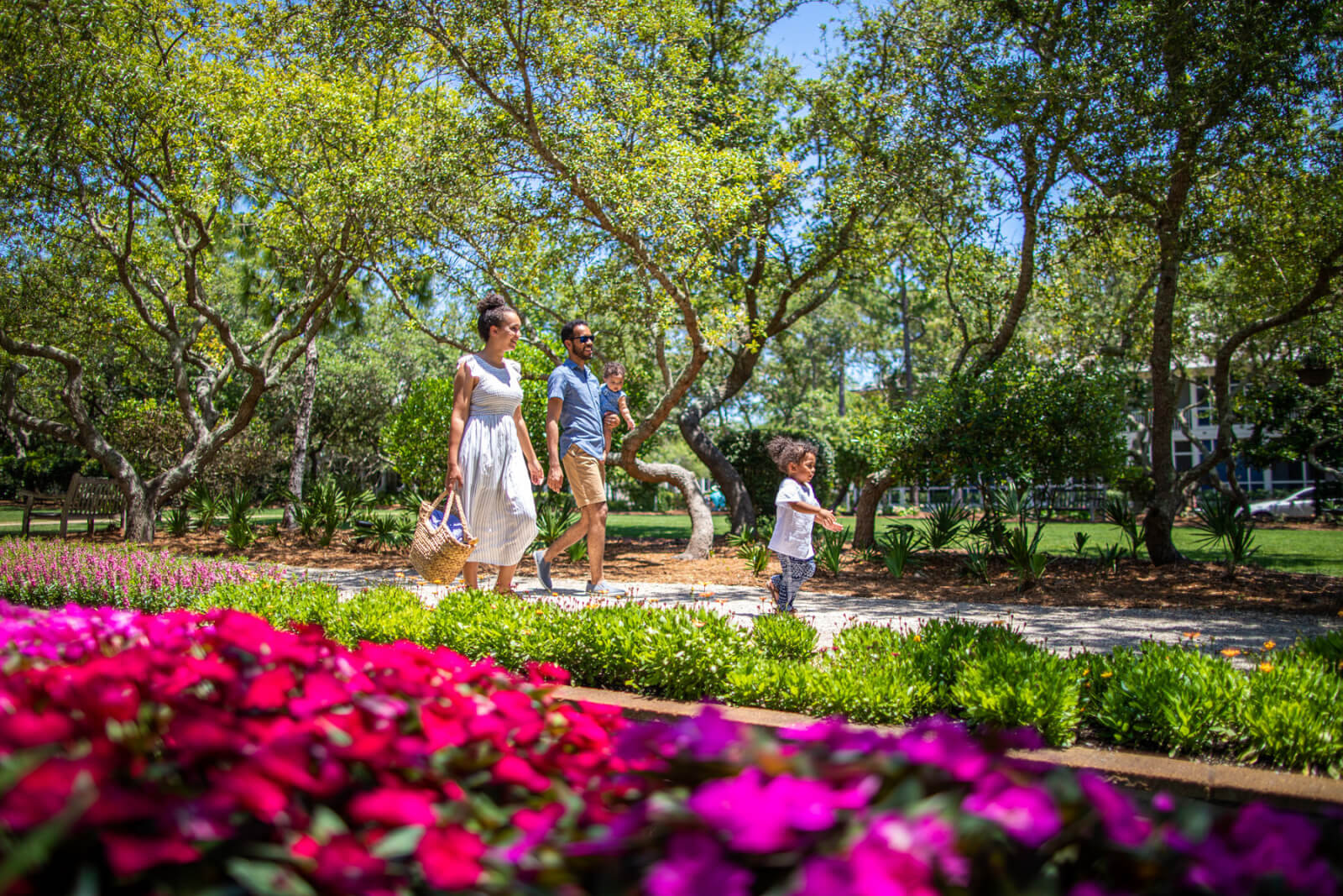 Family walking through landscaped grounds at WaterColor Inn