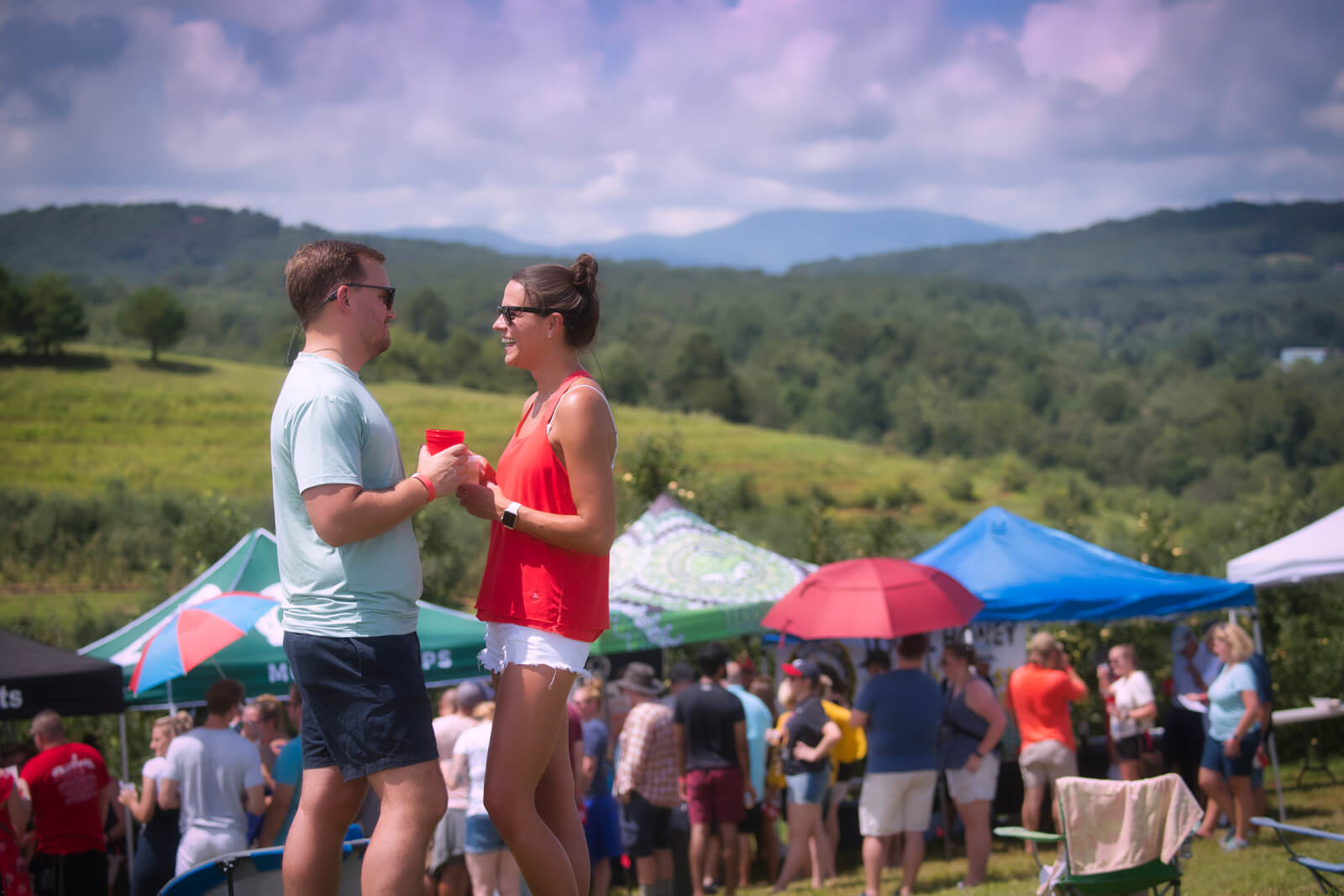 Man and woman talking at Blue Ridge, GA, event