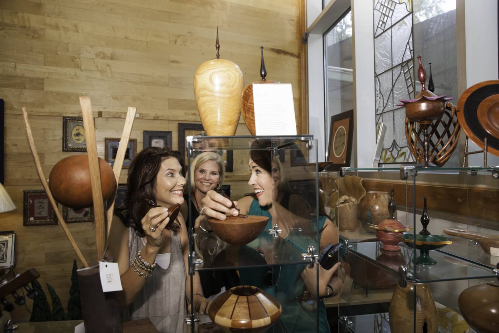 Three women shopping at Bill Waller Craft Center