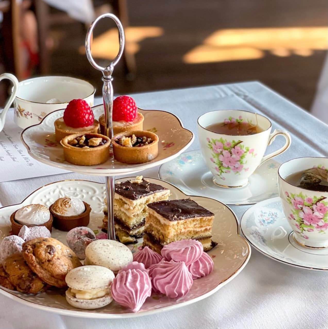 Afternoon tea set up with cakes and treats.