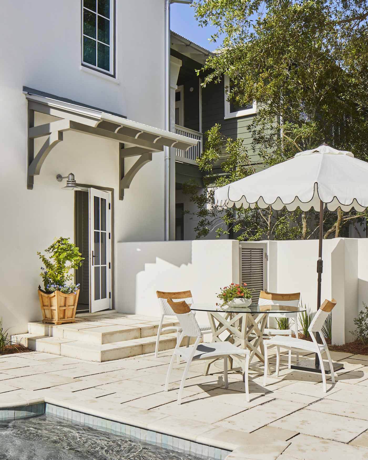 Outdoor dining area next to swimming pool