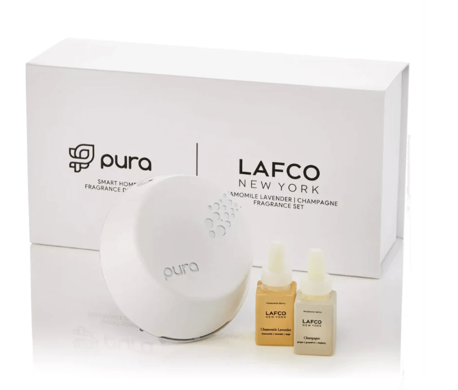 The Pura smart home fragrance diffuser with LAFCO New York's chamomile lavender and champagne scent bottles. Its sleek packaging will be right at home in Birmingham's most stylish interiors.