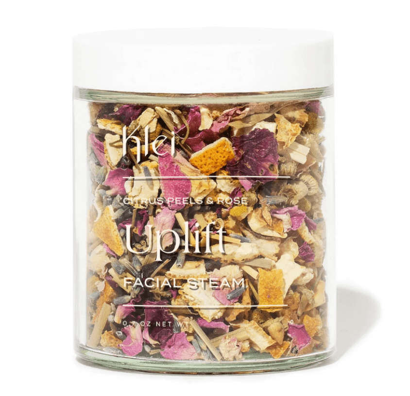 The "Uplift Facial Steam" jar, showcased at Nashville FINDS in January, features visible citrus peels and rose petals through its clear packaging, offering a refreshing and aromatic experience.